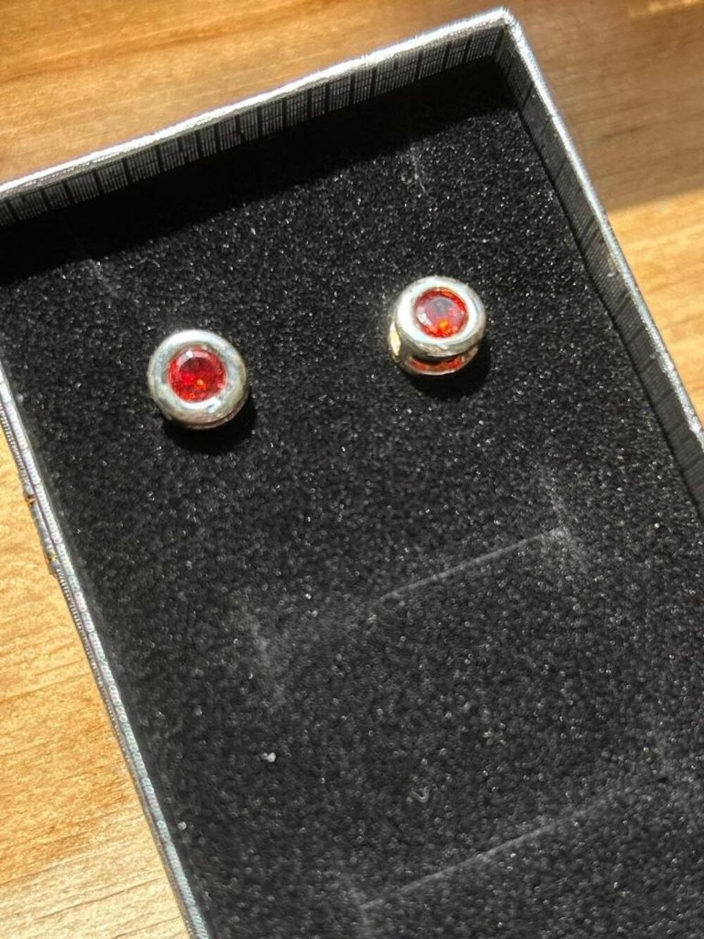 Silver and red stud earrings. Costume jewelry